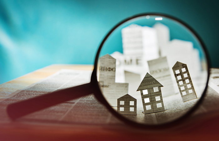 Paper-house-under-a-magnifying-lens.jpg