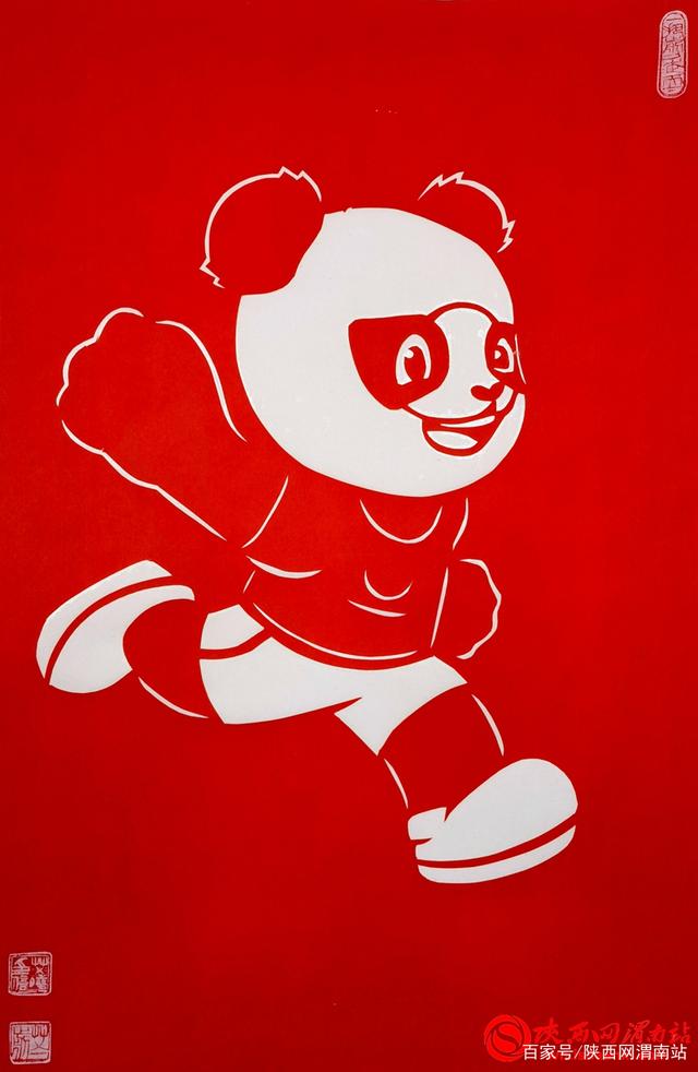 非遗传承人艾晓:巧手剪纸展十四运风貌(组图)