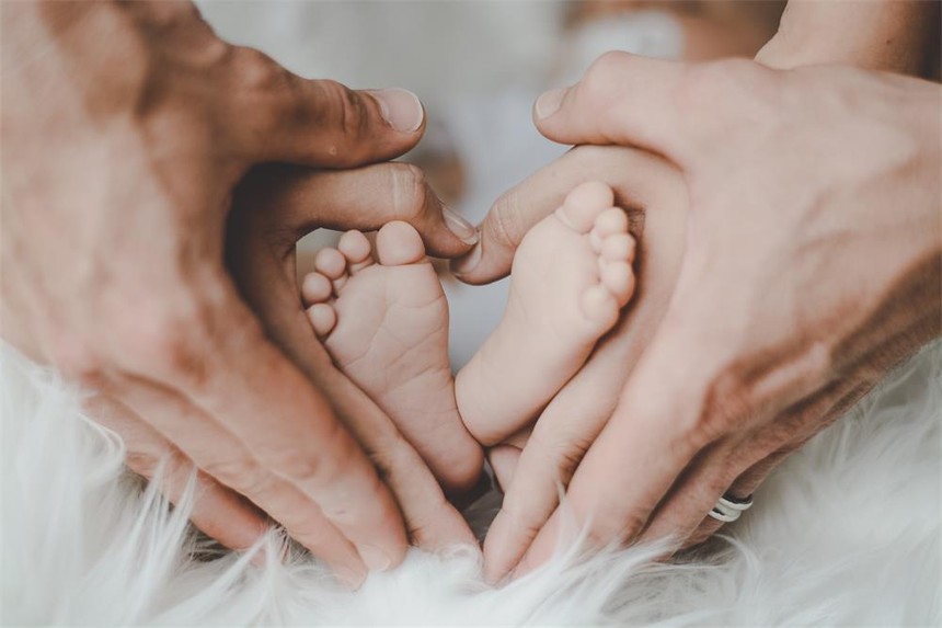 person-holding-baby-s-feet-2456327.jpg