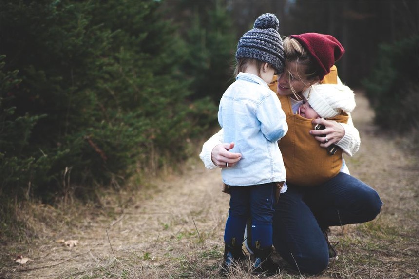 woman-with-brown-baby-carrier-and-little-kid-in-white-jacket-701014.jpg