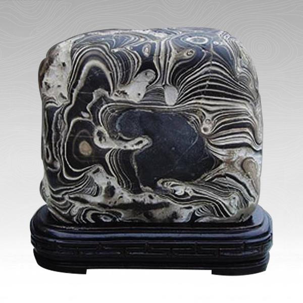 色泽黄褐 奇石类型: 景观石 基本介绍 来宾卷纹石产于广西红水河来宾