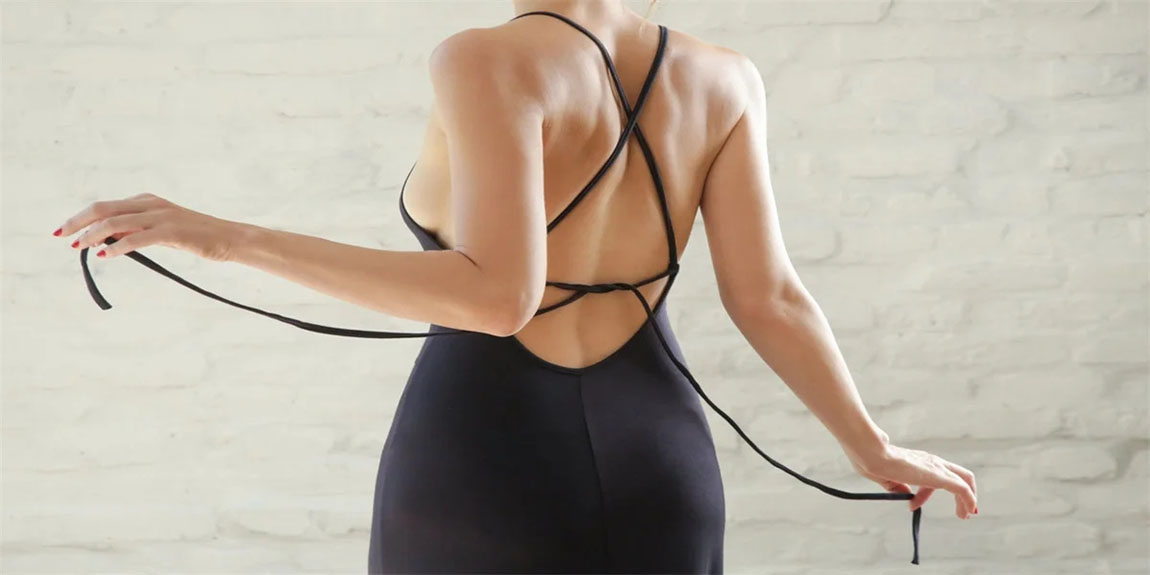 Fashion-portrait-of-Caucasian-woman-in-tight-black-jersey-dress-with-open-back.webp.jpg