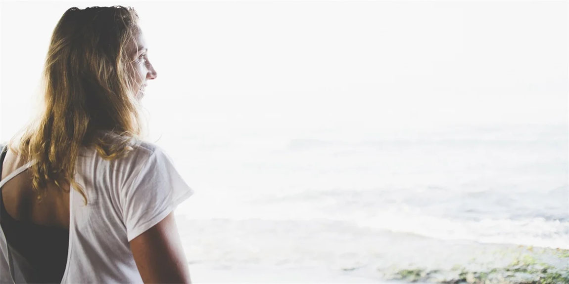 Side-profile-of-young-woman-against-waves.webp.jpg