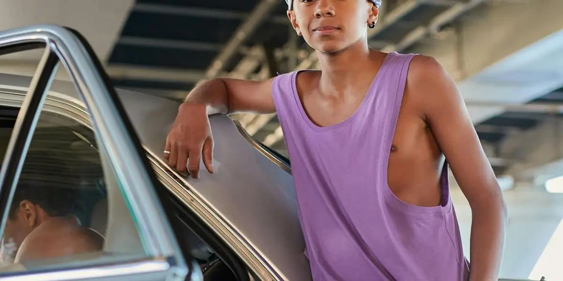 Stylish-young-man-in-streetwear-leaning-on-car-under-urban-bridge-by-cottonbro-studio.webp.jpg
