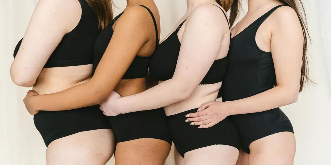 Four-diverse-women-in-black-underwear-hugging-promoting-body-positivity-and-inclusivity-by-Antoni-Shkraba.webp.jpg