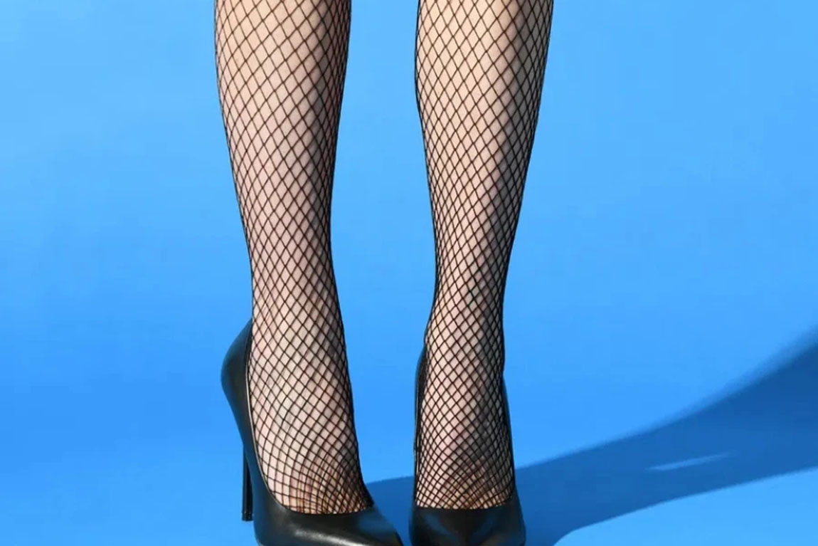 Slender-sexual-legs-of-crop-unrecognizable-female-in-fishnets.webp.jpg