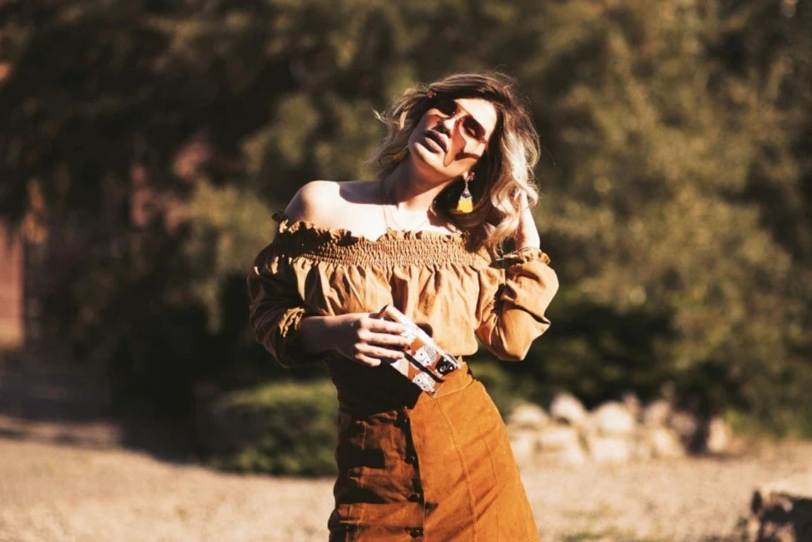 Woman-touching-her-hair.webp.jpg