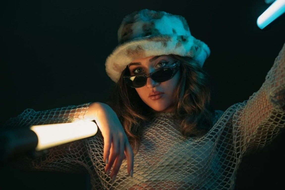 Woman-Posing-in-a-Fluffy-Hat.webp.jpg