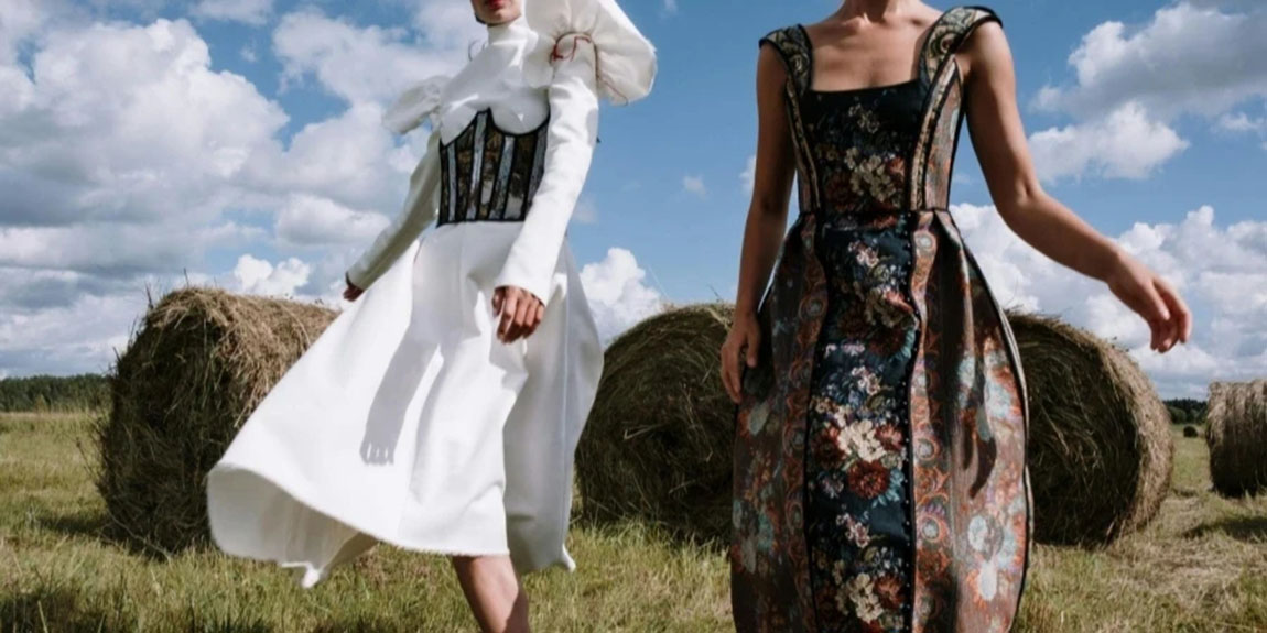 Two-Women-in-Stylish-Outfits-Standing-on-Farm.webp.jpg