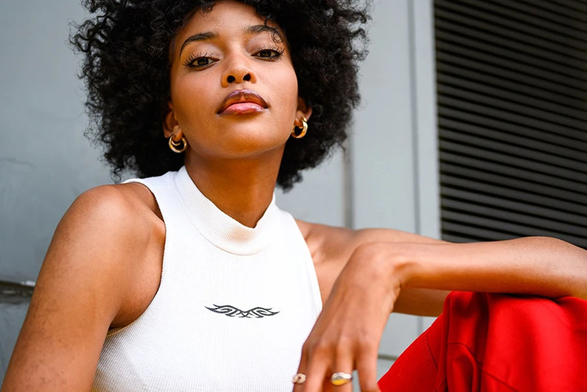 woman-wearing-elegant-white-tank-top-and-red-trousers.webp.jpg