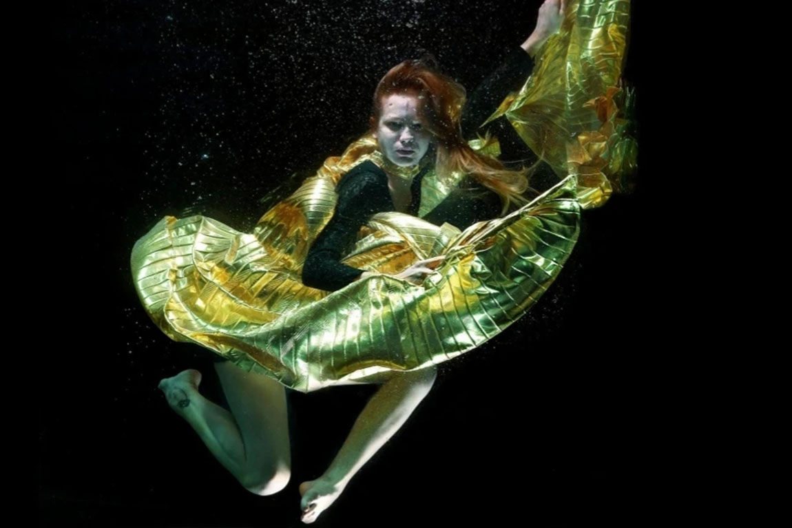 Underwater-Photo-of-Woman-Wearing-Green-and-Black-Dress.webp.jpg