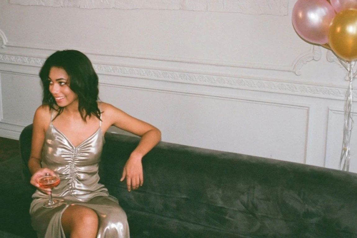 Woman-Sitting-on-Sofa.webp.jpg