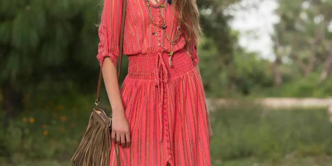 Stylish-woman-in-a-red-dress-posing-outdoors-in-a-natural-setting-by-Rulo-Davila.webp.jpg