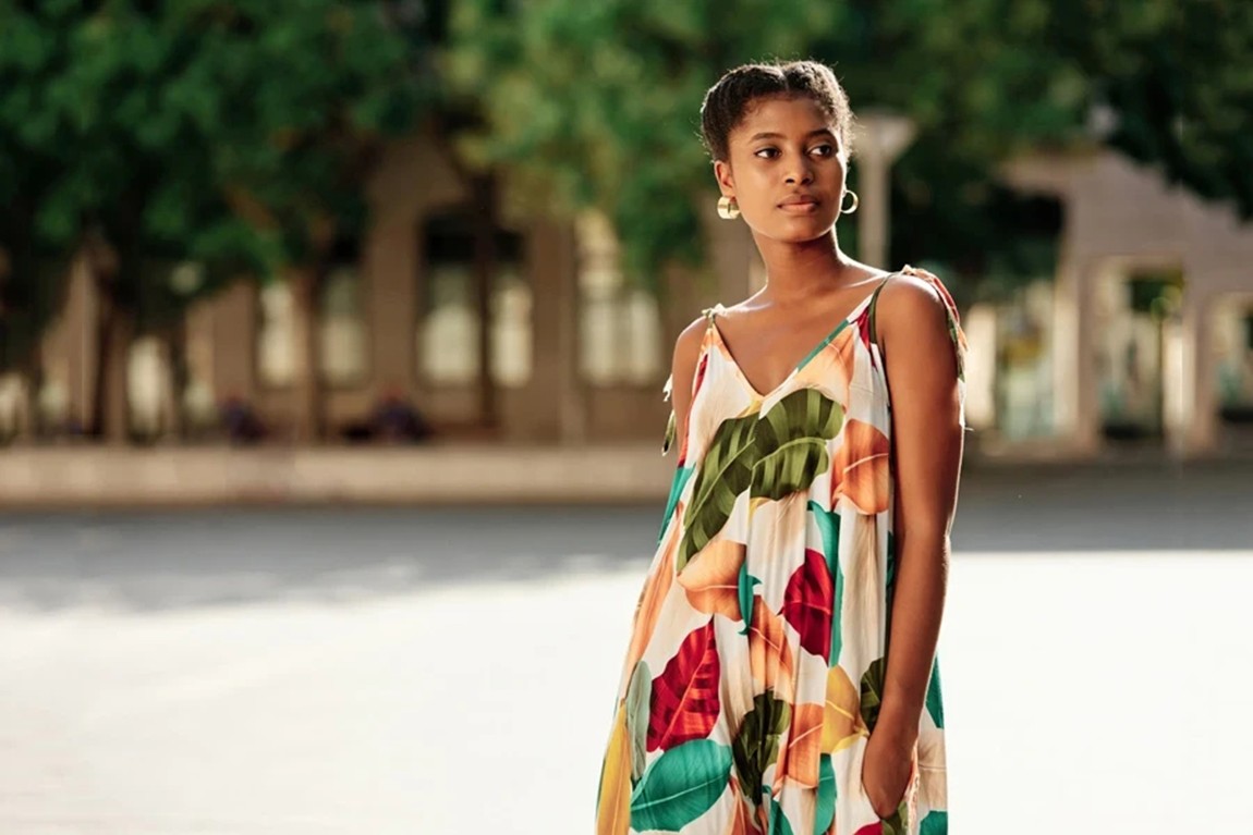 Woman-posing-in-a-V-neck-sundress.webp.jpg