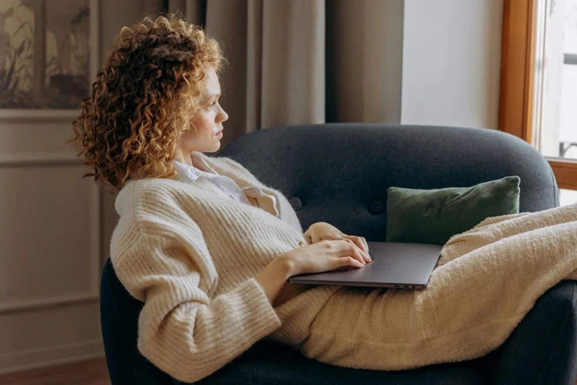 Woman-Sitting-on-Sofa-Chair.webp.jpg