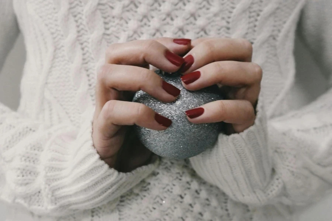 Person-Holding-Gray-Ball.webp.jpg