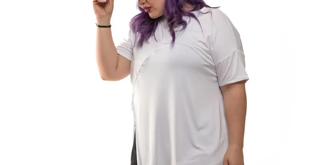 Confident-plus-size-model-in-white-tee-and-black-pants-showcases-trendy-streetwear-with-colorful-hair-by-INFECTED-Store.webp.jpg