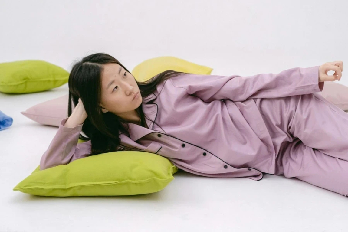 Woman-in-Purple-Sleepwear-Lying-Down-on-Floor.webp.jpg
