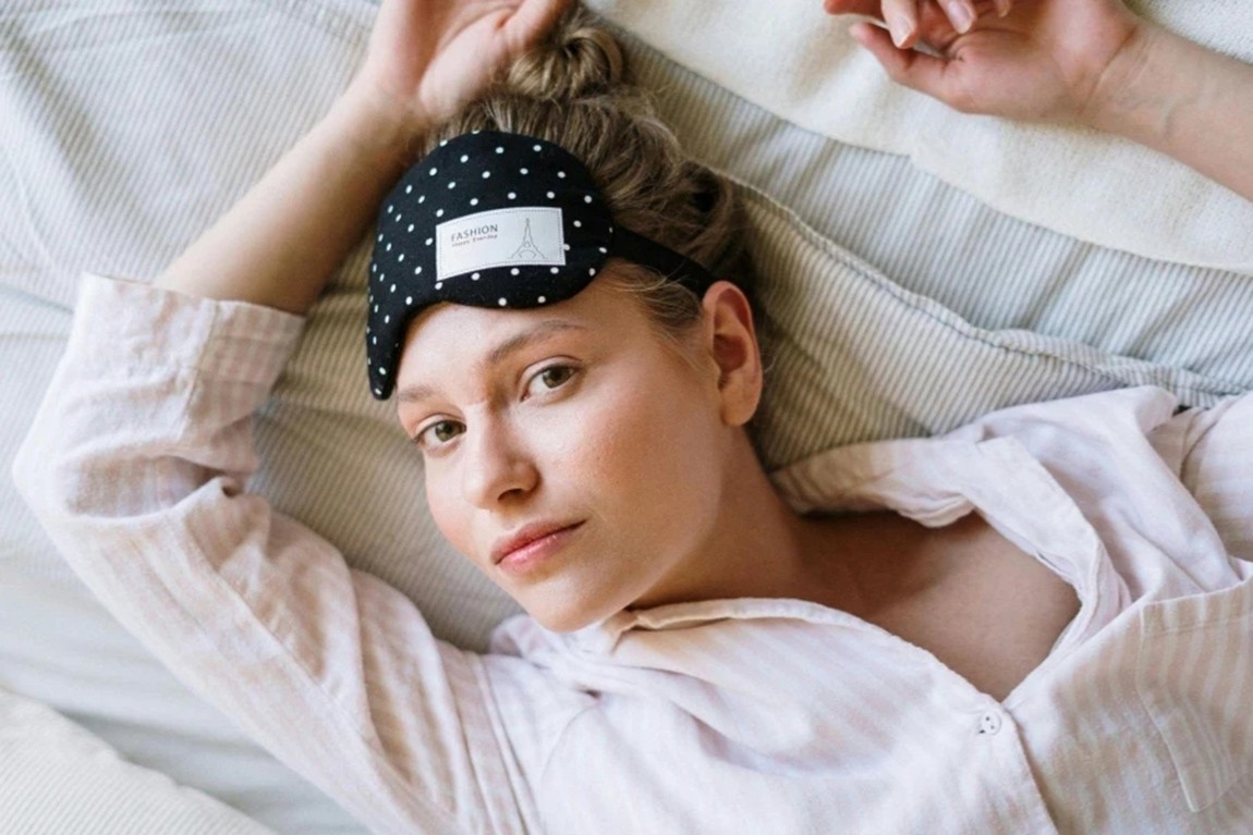 Woman-in-White-Shirt-Lying-on-Bed.webp.jpg