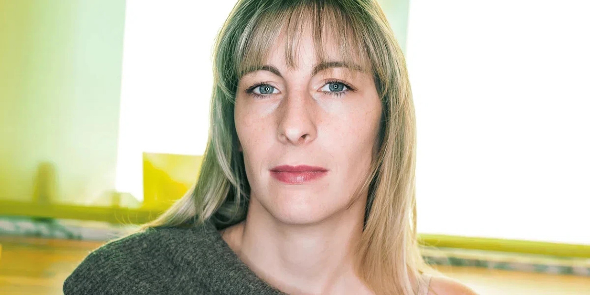 Woman-with-a-wool-sweater-and-bare-shoulder-looks-demanding-at-the-camera-1.webp.jpg