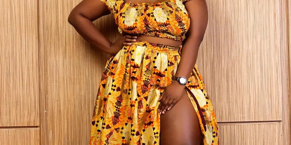 Confident-African-woman-posing-elegantly-in-a-vibrant-yellow-dress-embodying-style-and-grace-by-Jennifer-Enujiugha.webp.jpg