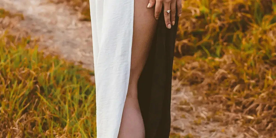 Fashionable-woman-in-a-split-skirt-and-sneakers-standing-on-a-rural-path-during-autumn-in-Mexico-by-Rodrigo-Hrdez.webp.jpg