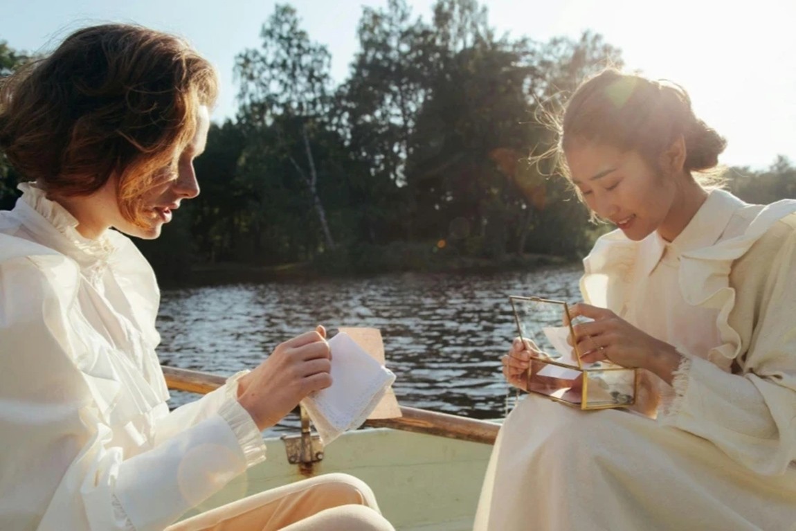 Friends-Sitting-in-the-Boat.webp.jpg