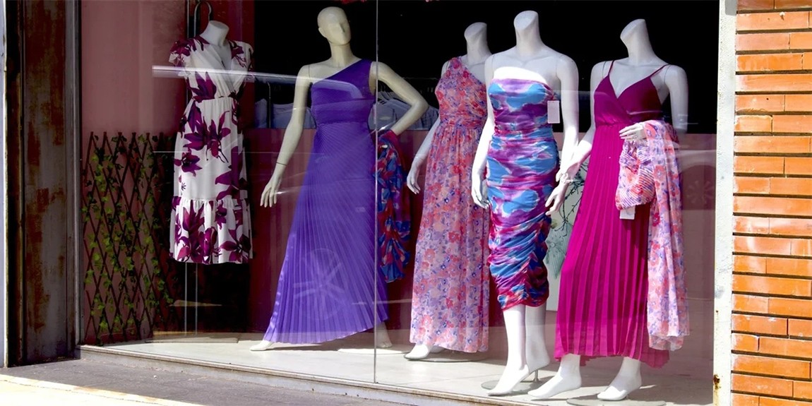 mannequins-with-long-dresses-in-a-shop-window.webp.jpg
