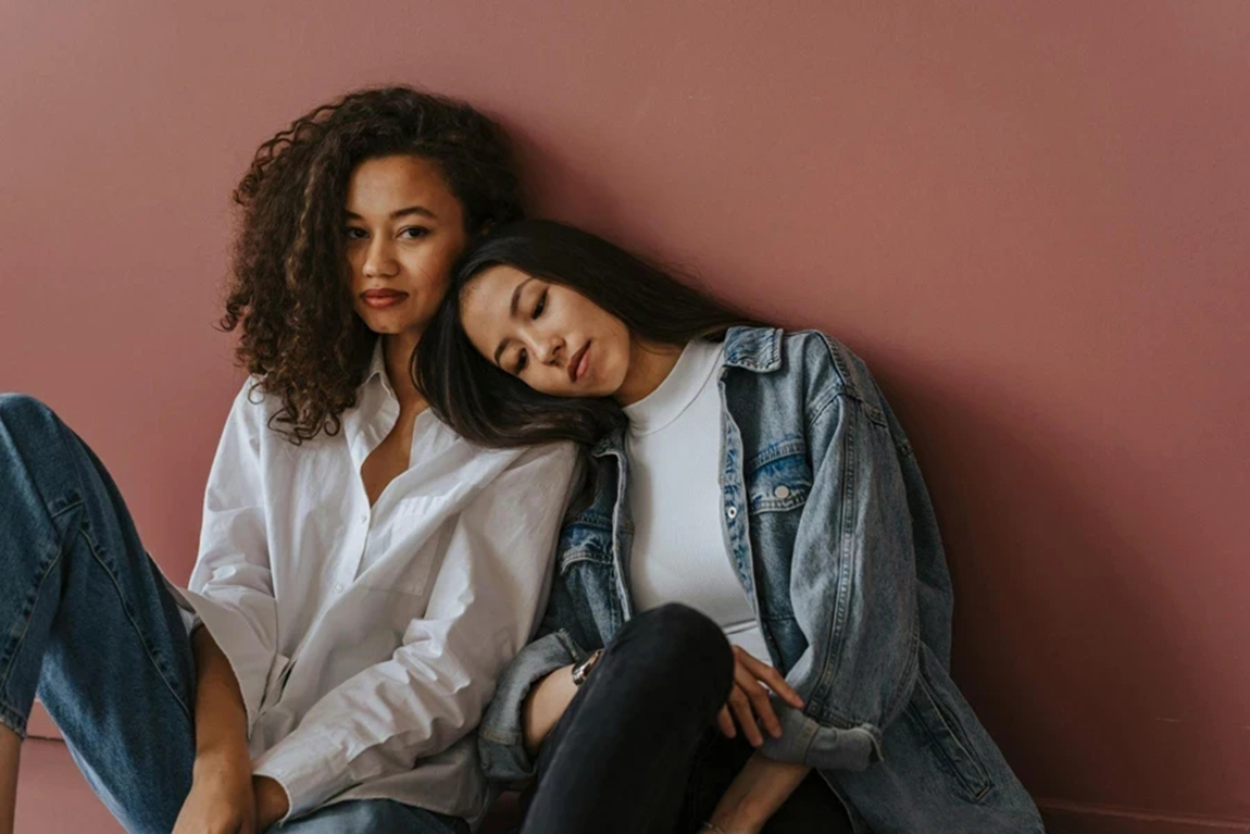 Two-Women-Leaning-on-Each-Other.webp.jpg