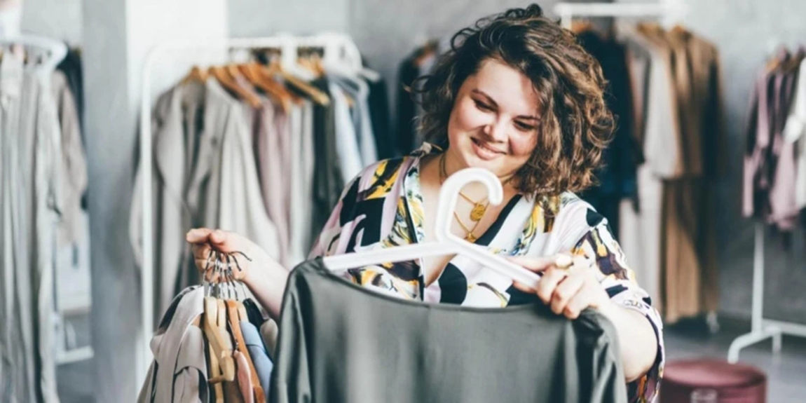 Plus-Size-Woman-Choose-Fashioned-Dress-in-Store.webp.jpg