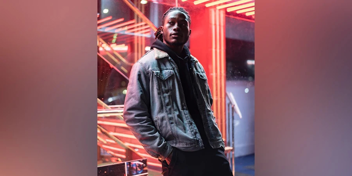 Model-wearing-a-black-hoodie-under-a-denim-blazer.webp.jpg