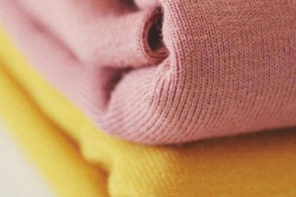 Bundles-of-pink-and-yellow-wool-fabric.webp.jpg