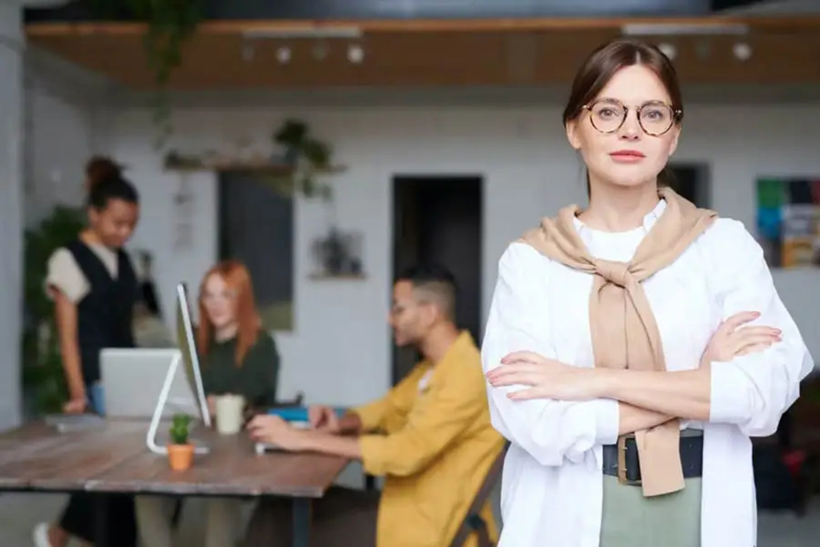lady-in-white-shirt-with-sweater-around-her-neck.webp.jpg