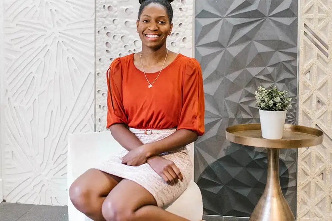 african-American-Lady-in-red-top-and-cream-skirt.webp.jpg