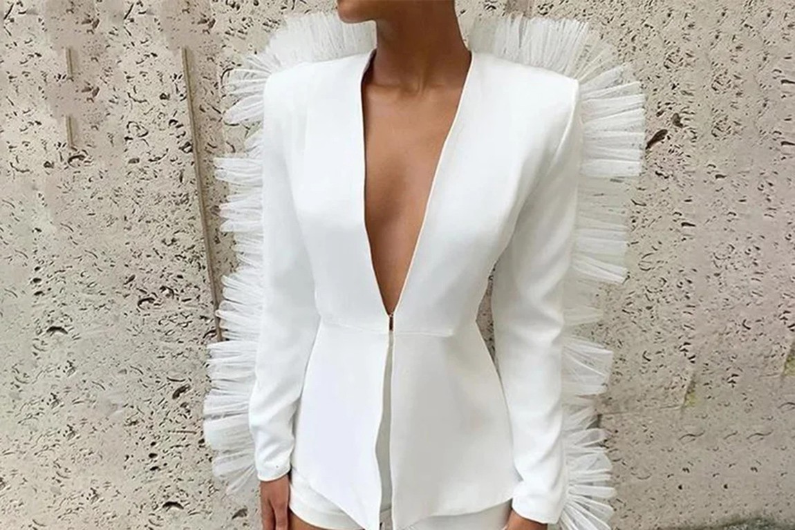 woman-wearing-a-white-jacket-with-ruffles.webp.jpg