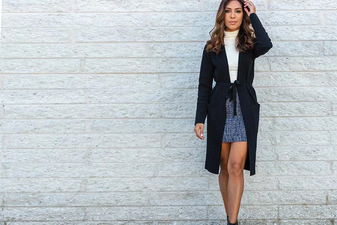 woman-wearing-a-black-cardigan-over-blue-skirt.webp.jpg
