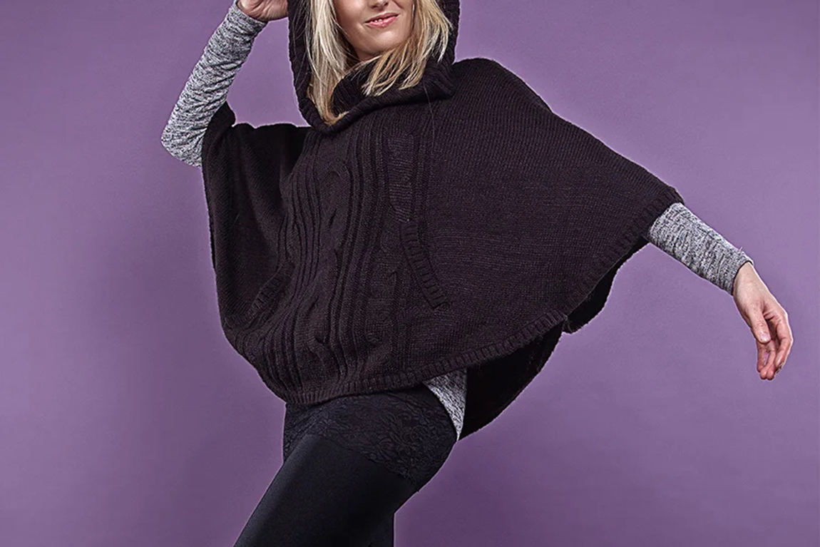 woman-striking-a-pose-in-a-black-poncho.webp.jpg