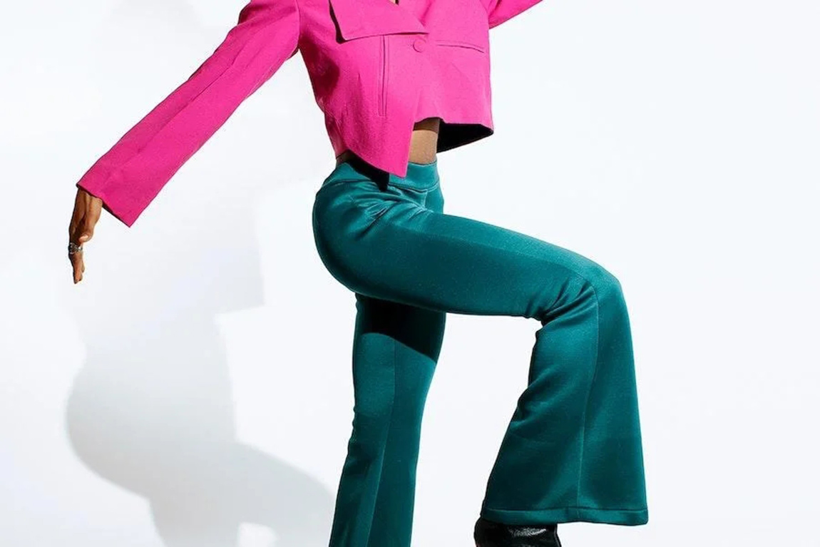 woman-posing-with-teal-green-flared-trousers.webp.jpg