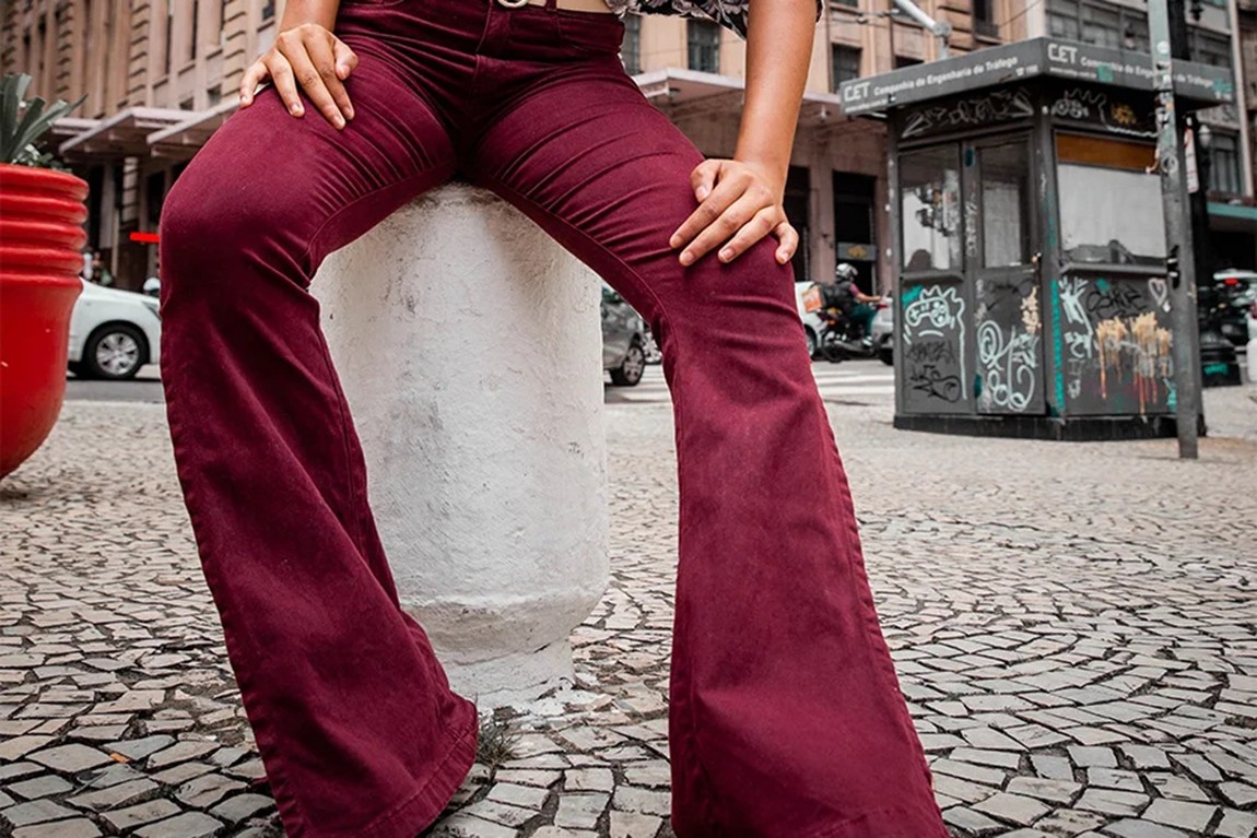 woman-posing-on-the-street-with-red-flared-jeans.webp.jpg