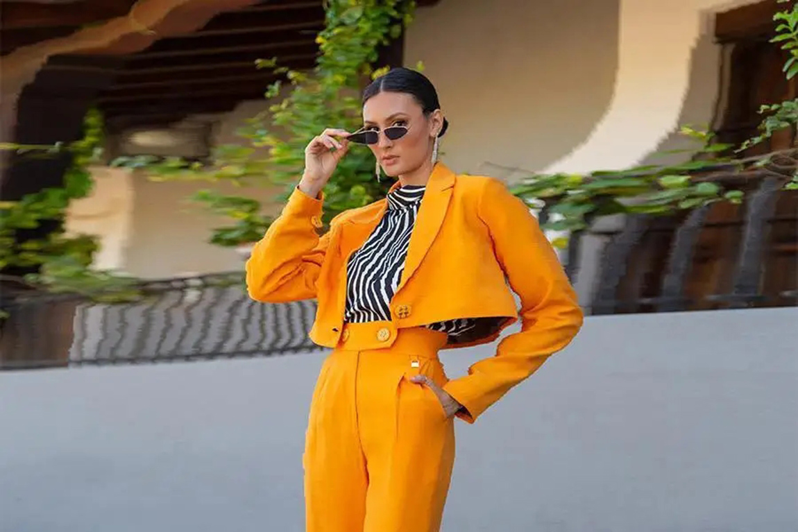 woman-wearing-an-orange-cropped-reworked-suit.webp.jpg