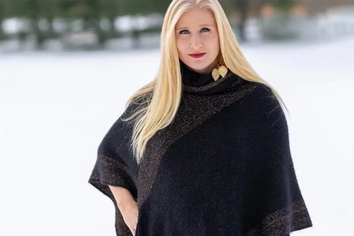 woman-wearing-a-deep-blue-poncho.webp.jpg