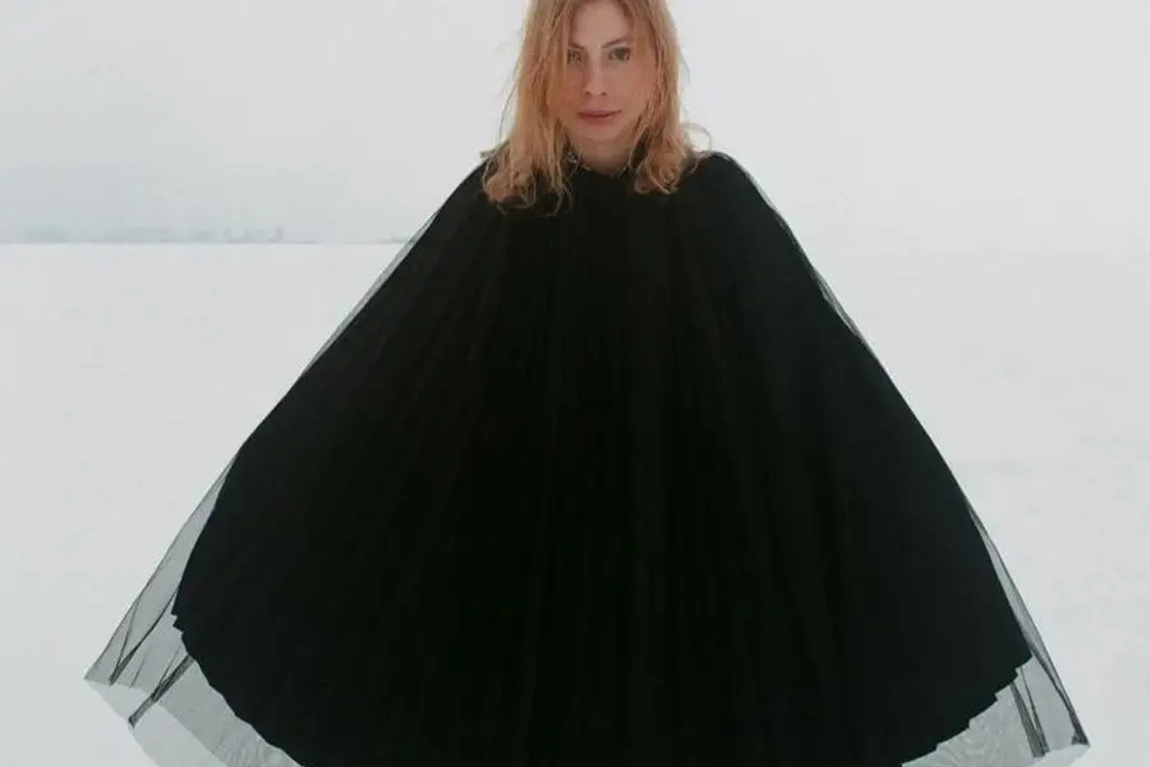 lady-wearing-a-black-silk-layered-poncho.webp.jpg
