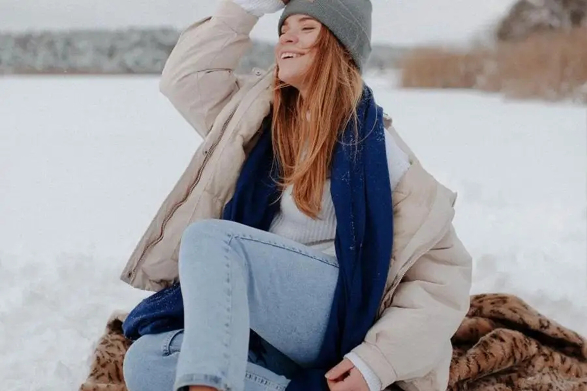 woman-wearing-a-cream-colored-puffer-jacket.webp.jpg
