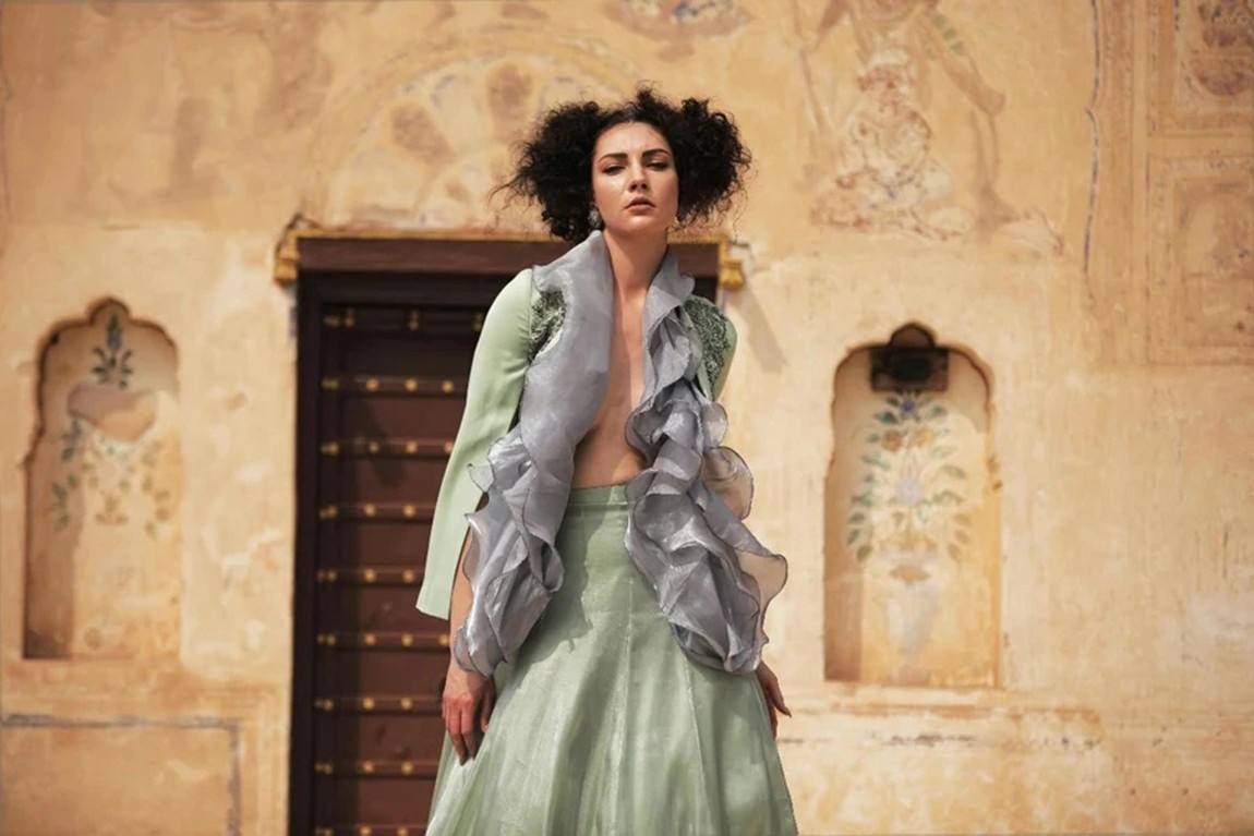 A-Woman-Wearing-a-Ruffle-Top-and-a-Green-Long-Skirt.webp.jpg
