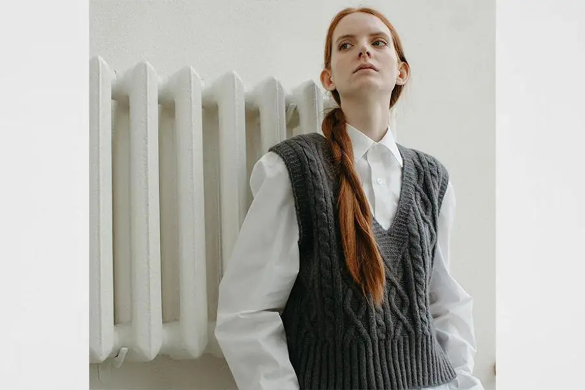 lady-rocking-a-gray-sweater-vest-over-a-white-shirt.webp.jpg