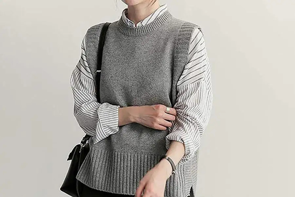 a-woman-in-a-gray-knitted-sweater-vest.webp.jpg