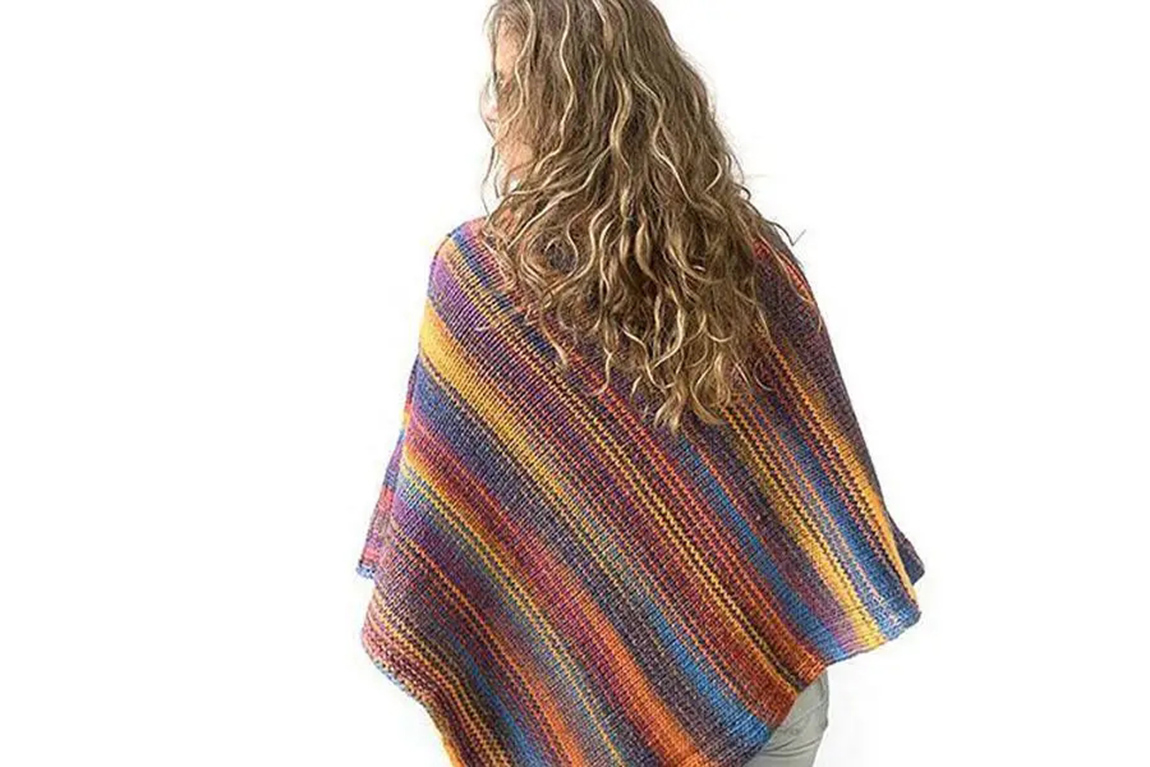 a-woman-in-a-multicolored-poncho.webp.jpg