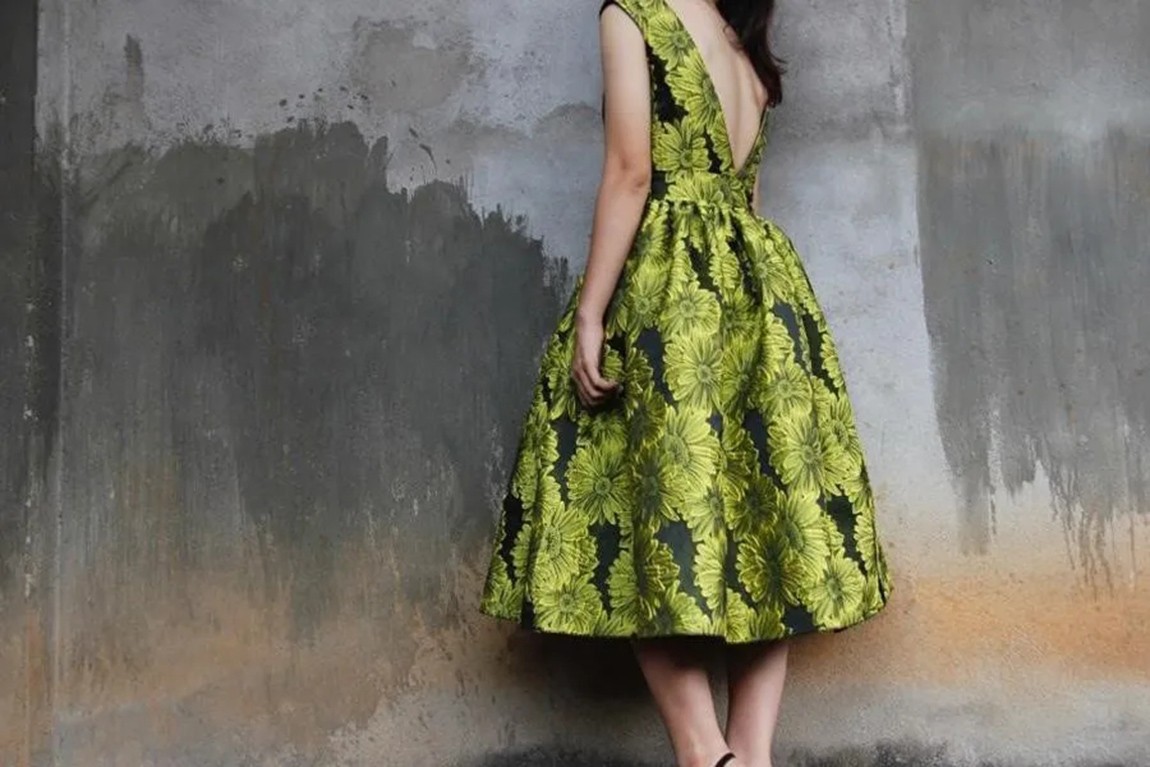 lady-wearing-a-green-floral-design-dress.webp.jpg