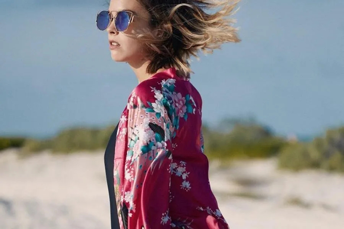lady-wearing-a-bright-red-shirt-with-an-intricate-floral-pattern.webp.jpg