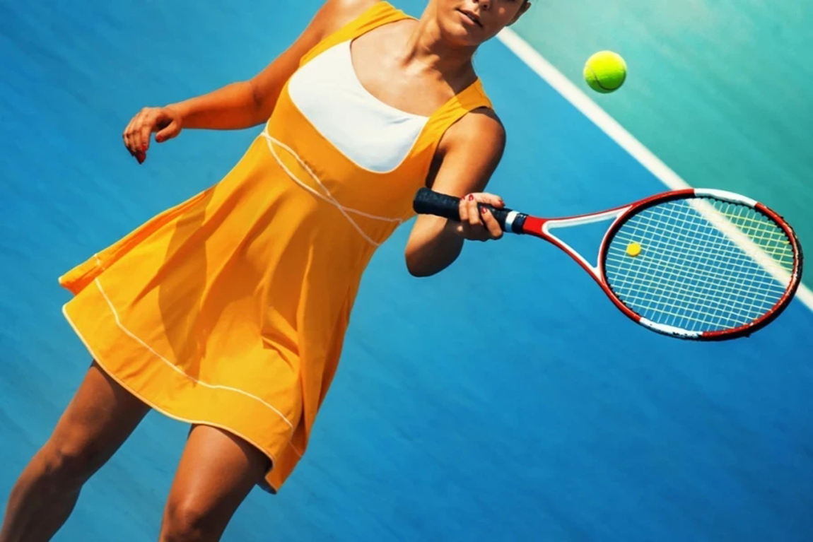 Female-player-wearing-vibrant-orange-and-white-tennis-dress.webp.jpg
